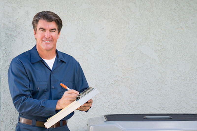 HVAC technician performing maintenance