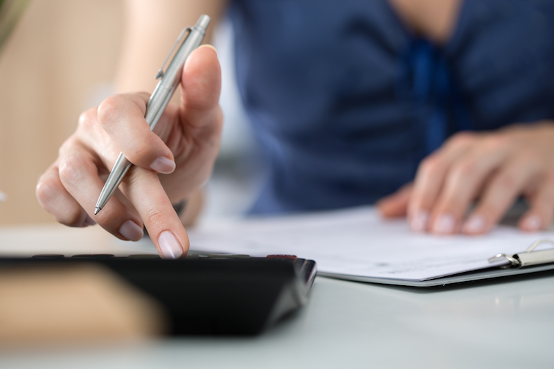 Woman using a calculator
