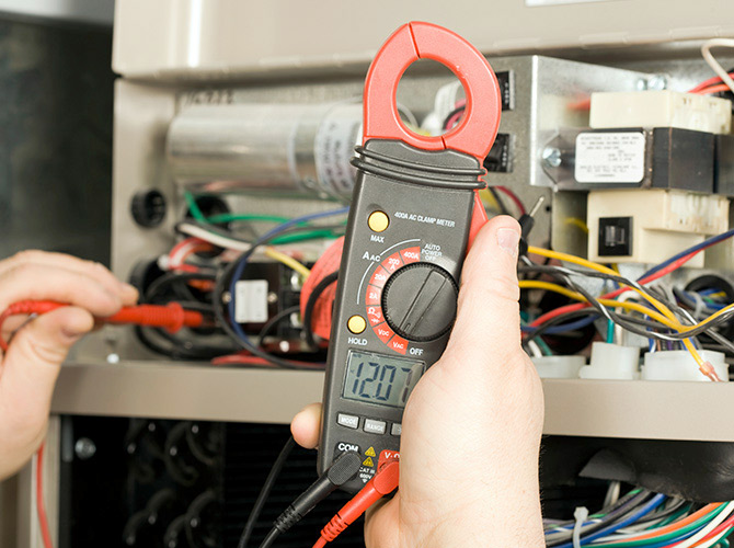 HVAC technician performing service