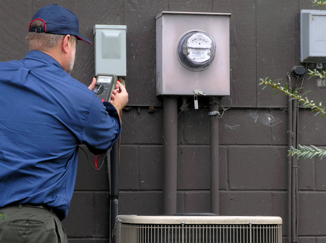 Man adjusting meter