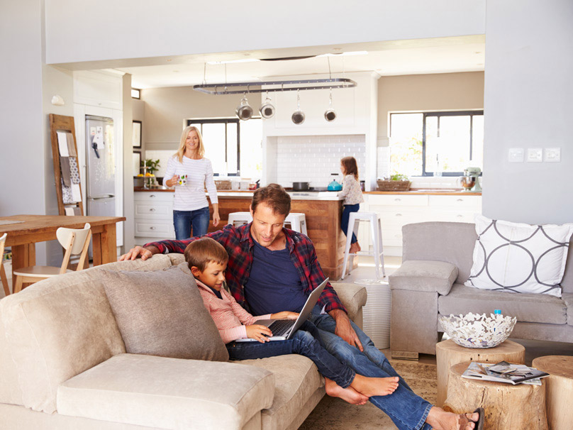 Family in the living room and kitchen