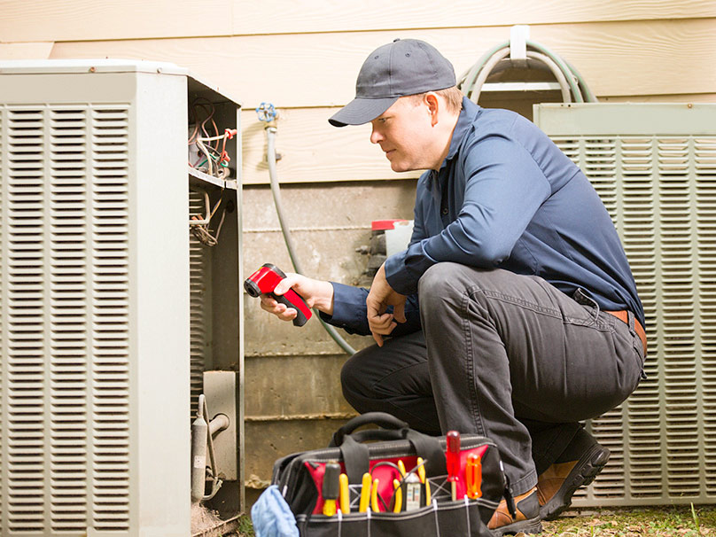 Man working on a heat pump
