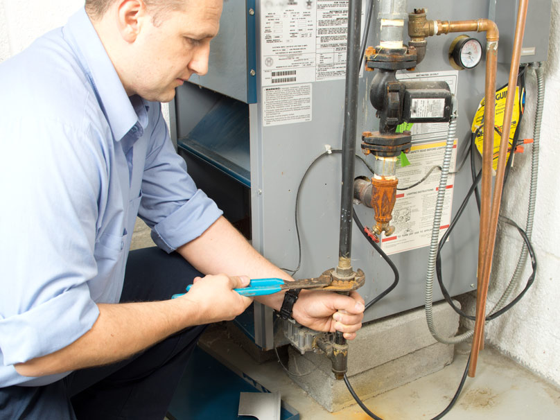 Man repairing a furnace