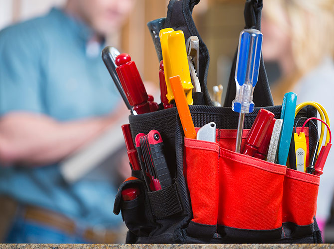 Tools on a counter with a person out of focus behind them
