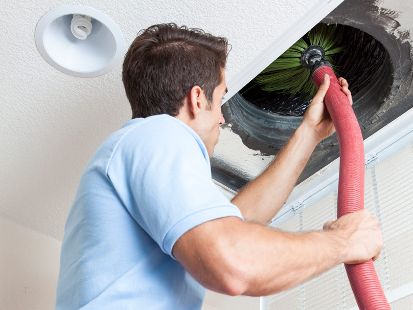 man performing duct cleaning