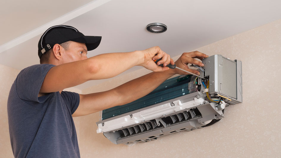 HVAC technician performing mini split maintenance