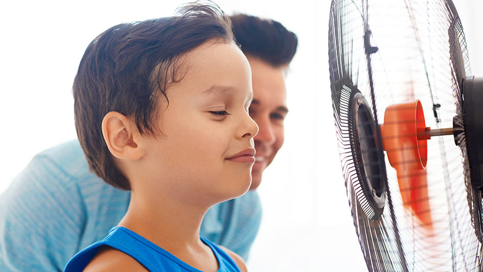 2021Blog_ACCost_945x533-12215 child standing in front of a fan