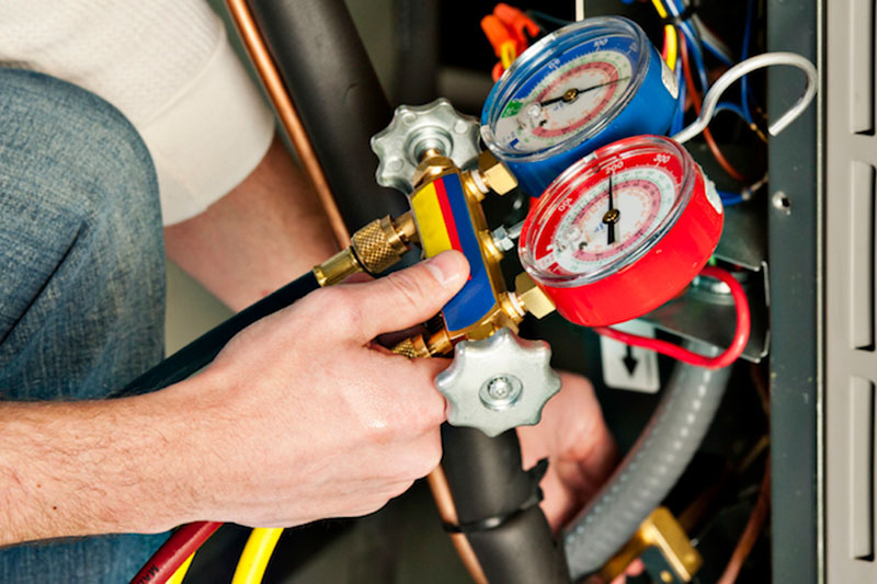 HVAC technician performing maintenance