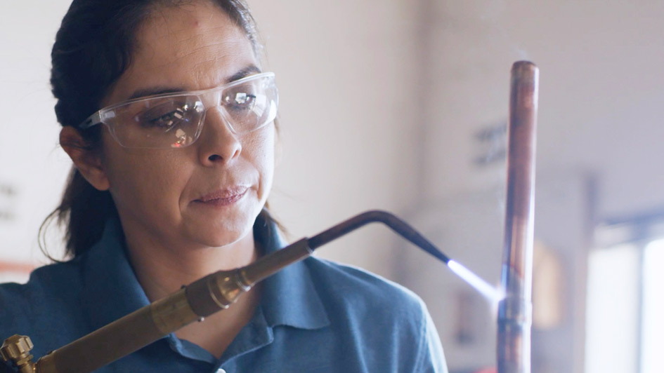 HVAC technician performing repairs