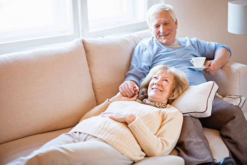 older couple relaxing on the couch