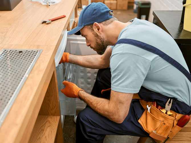 technician install a commercial fridge