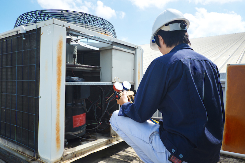 Technician checking an air conditioner