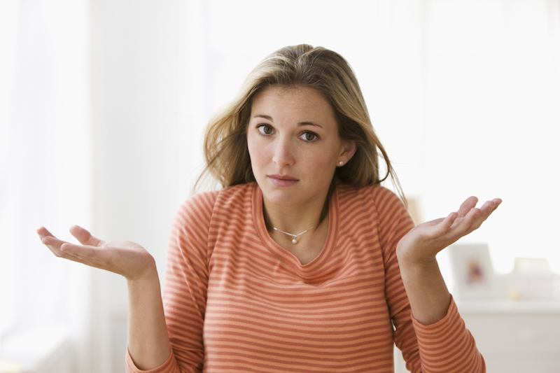 Young woman looking confused