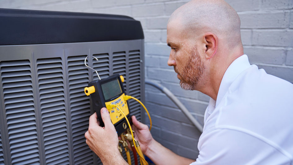 HVAC tech performing HVAC maintenance