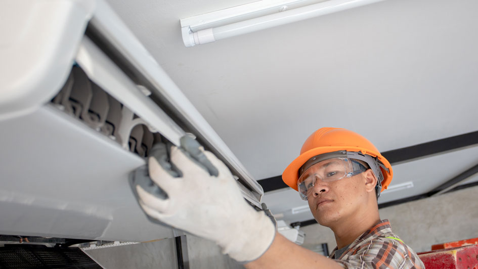 Man installing mini split