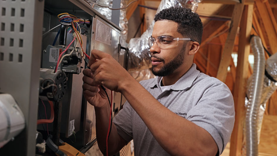 Technician working on furnace