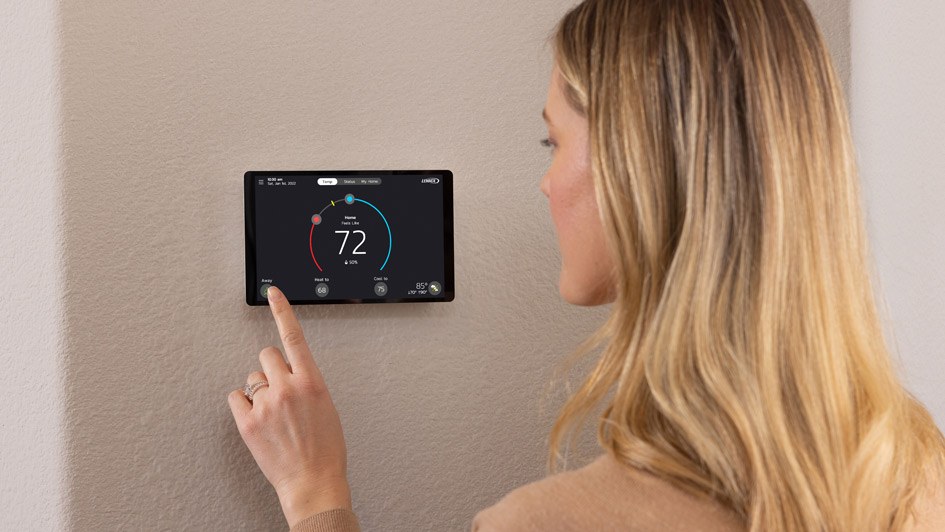 Woman changing thermostat