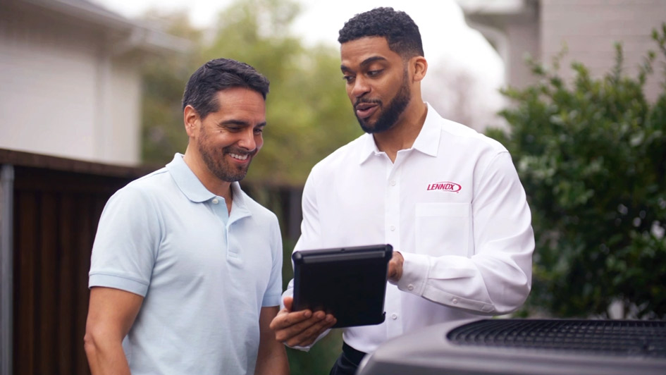 HVAC technician explaining a service agreement
